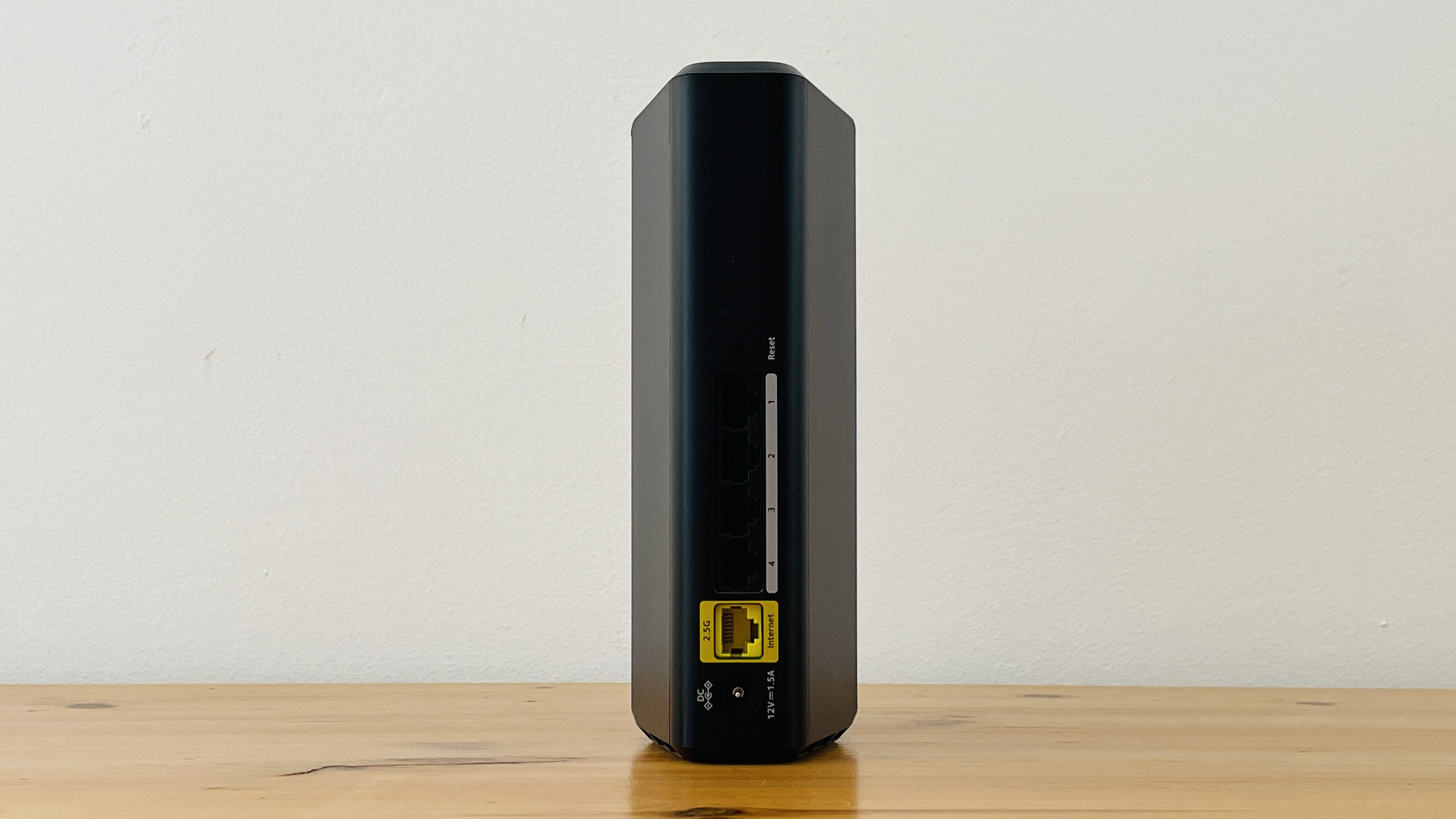 Netgear Nighthawk RS100 router on wooden table