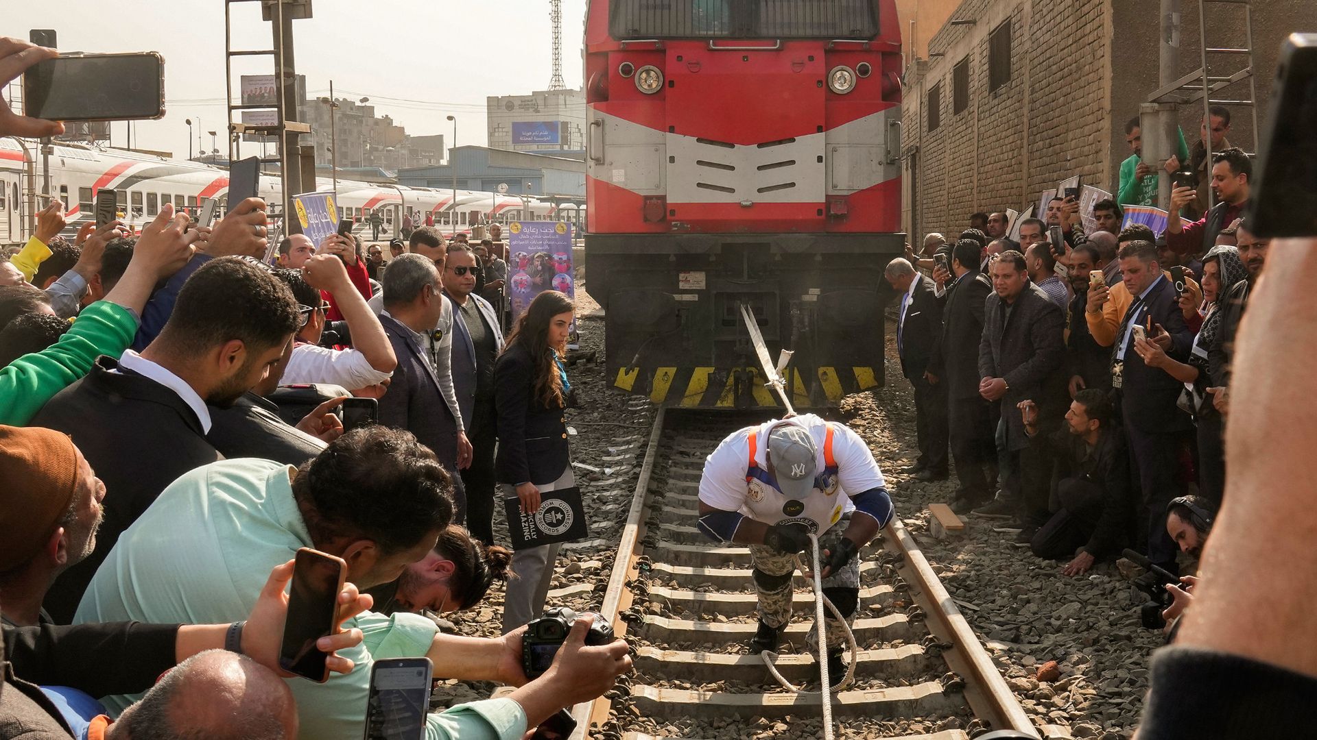 
                                Egyptian wrestler Ashraf Mahrous pulls a train, breaking three Guinness World Records in Cairo, Egypt
                            