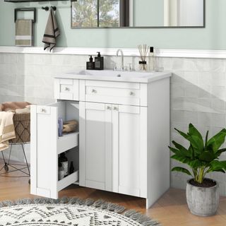 EUROCO Bathroom Vanity unit in a bathroom with grey tiles, green walls, and a wood floor