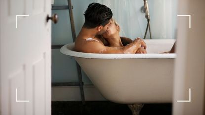 Woman and man in bath kissing after learning how to have better sex