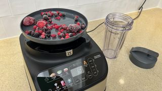 Kenwood MultiPro OneTouch Food Processor and Blender being used to weigh frozen berries