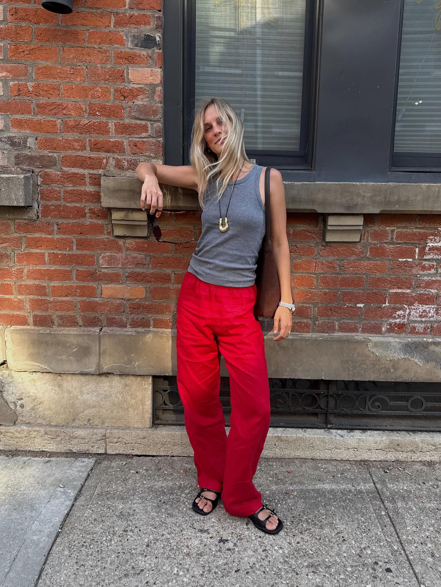 An image of @hannahallen00 wearing black shoes with red jeans.