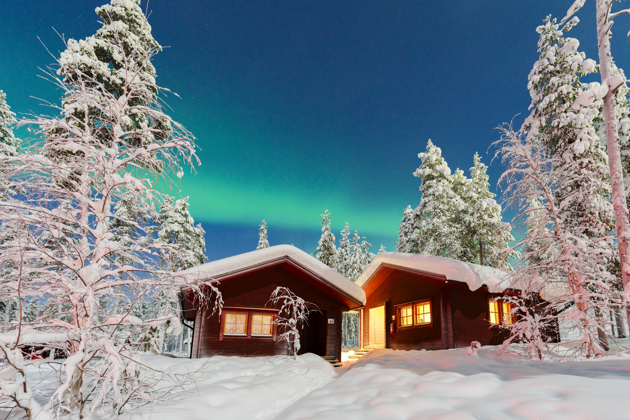 Wood cottages and the Aurora Borealis, Lapland, Finland