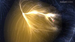 Scientists have created the first map of a colossal supercluster of galaxies known as Laniakea, the home of Earth's Milky Way galaxy and many other. This computer simulation, a still from a Nature journal video, depicts the giant supercluster, with the Milky Way's location shown as a red dot.