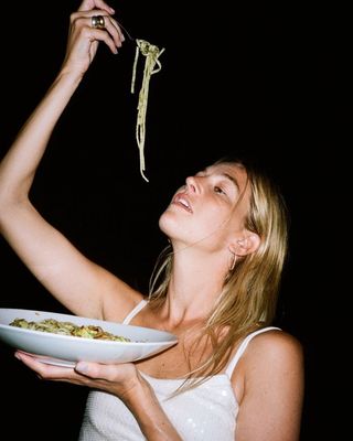 Content creator Camille Charriere eating pasta