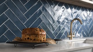 glossy blue herringbone kitchen tiles