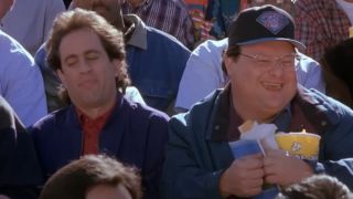 Jerry Seinfeld and Wayne Knight sitting together at the Super Bowl on Seinfeld