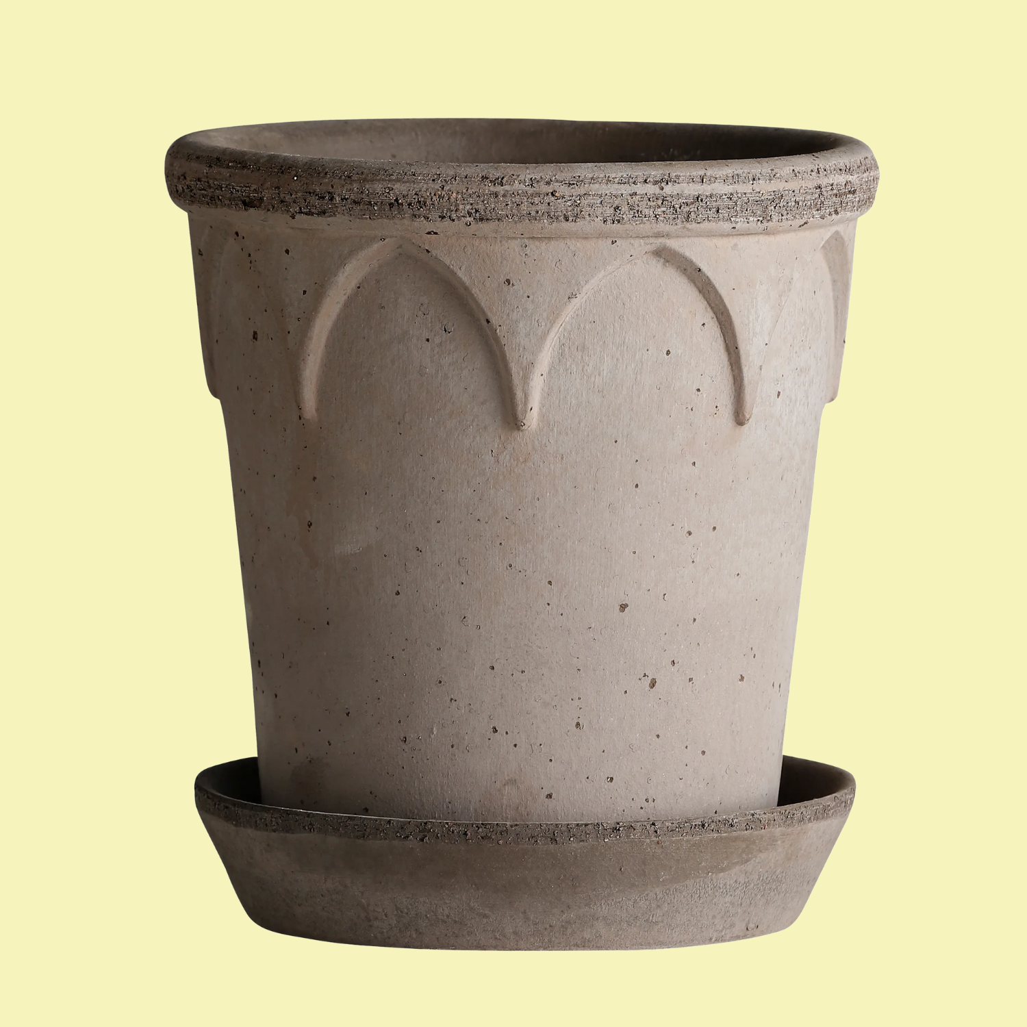 A gray planter with a saucer