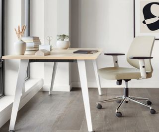 A beige padded office chair in a home office