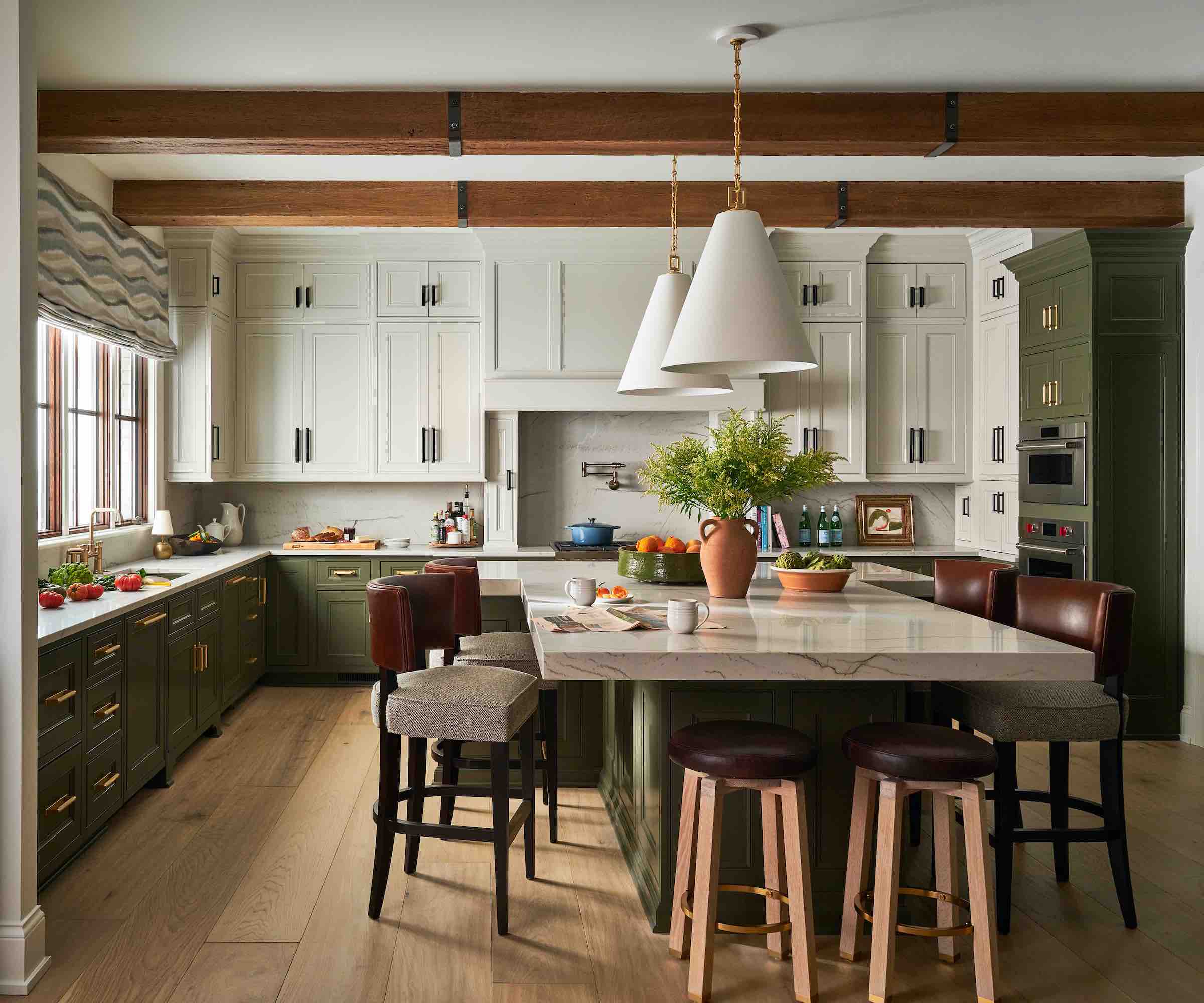 dark green and white kitchen with wood floors