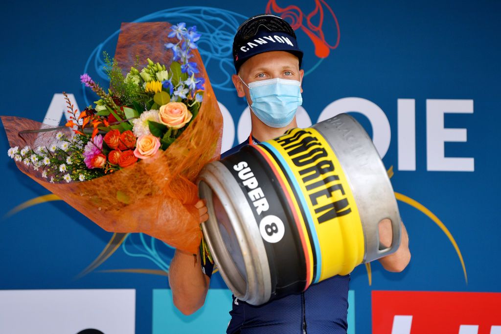 ARDOOIE BELGIUM SEPTEMBER 02 Tim Merlier of Belgium and Team AlpecinFenix celebrates winning the stage on the podium ceremony after the 17th Benelux Tour 2021 Stage 4 a 1661km stage from Aalter to Ardooie BeneluxTour on September 02 2021 in Ardooie Belgium Photo by Luc ClaessenGetty Images