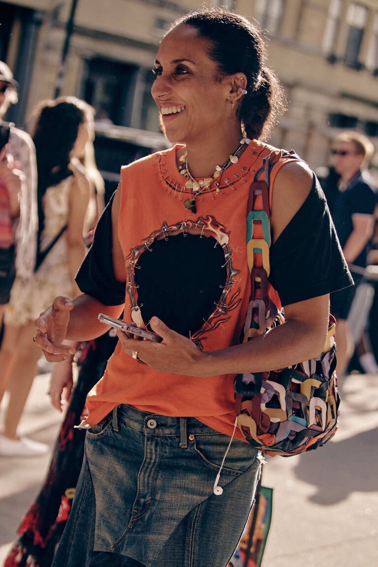 a woman wearing the shell motif jewelry summer 2026 trend at fashion week