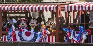 Mickey Minnie and Pluto on board the Disneyland Railroad