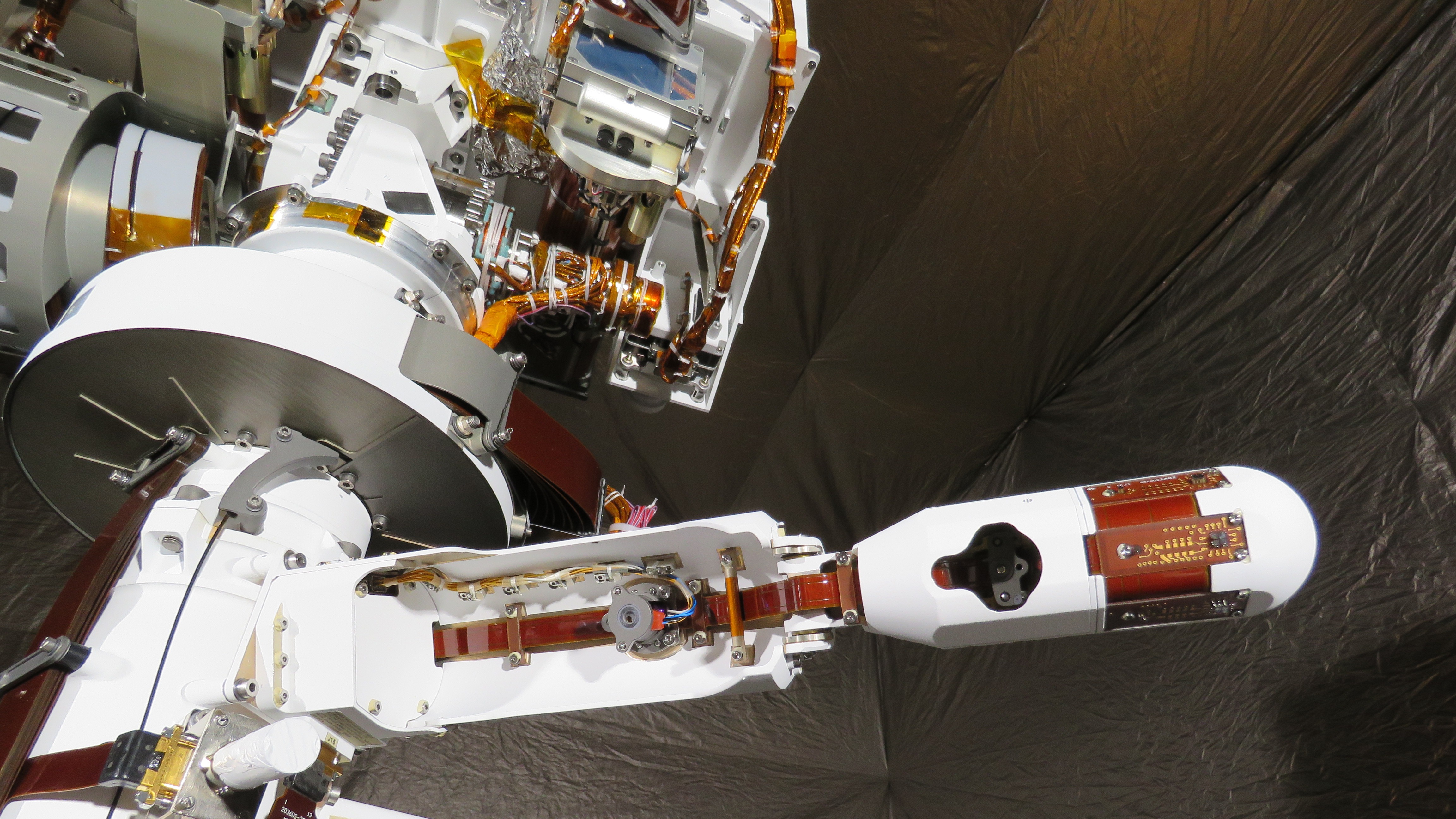 During practice activities on Earth in 2019, the Perseverance rover deploys one of its wind sensors on the Mars Environmental Dynamics Analyzer.