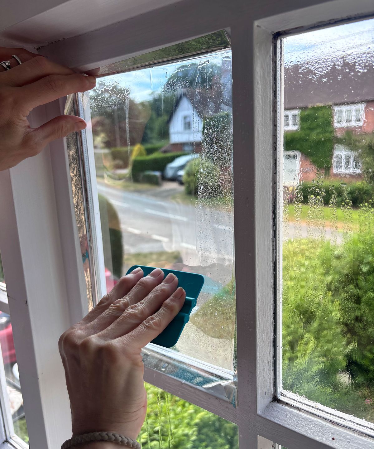 using a squeegee to flatten solar control window film