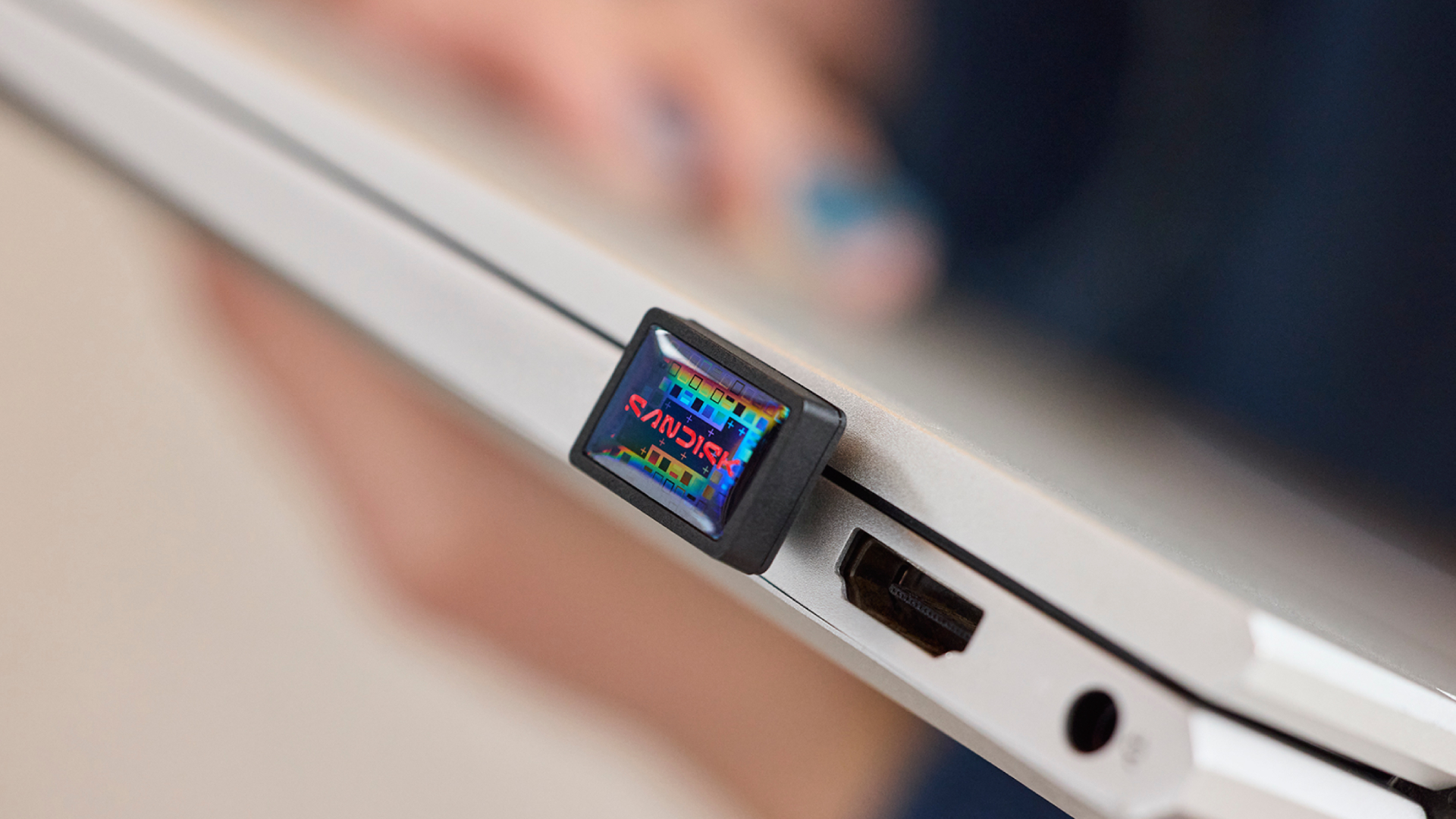 The SanDisk Extreme Fit USB-C flash drive plugged into a laptop USB port