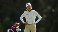 Jenny Shin stands with her hands on her hips at the 2023 Australian Open