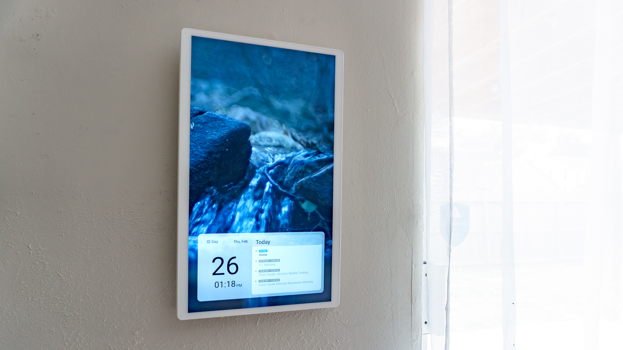 The Cozyla Calendar 2+ mounted to a wall in portrait mode