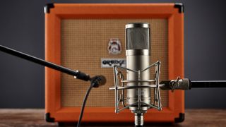 Two microphones in front of an Orange Crush 35RT guitar amp