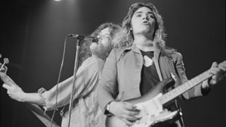 bassist Glenn Hughes and guitarist Tommy Bolin (1951-1976) from English rock band Deep Purple perform live on stage at the Civic Center in Providence, Rhode Island, USA on 19th January 1976