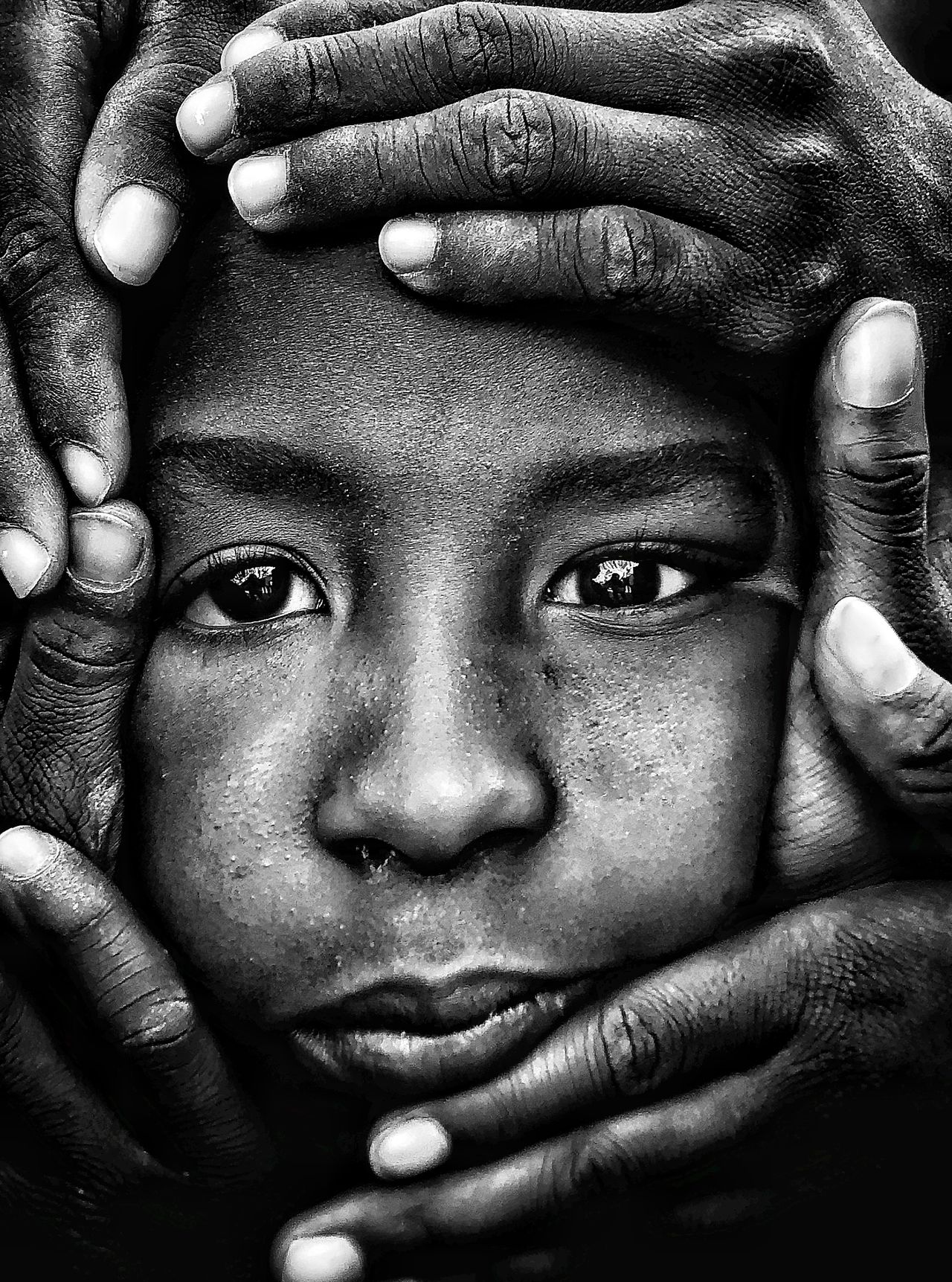 Face surrounded by hands photo for the iPhone Photography Awards 2021