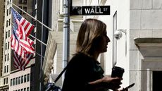 Woman walking on Wall Street