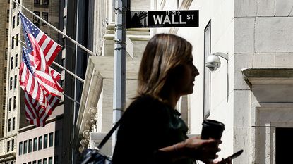 Woman walking on Wall Street