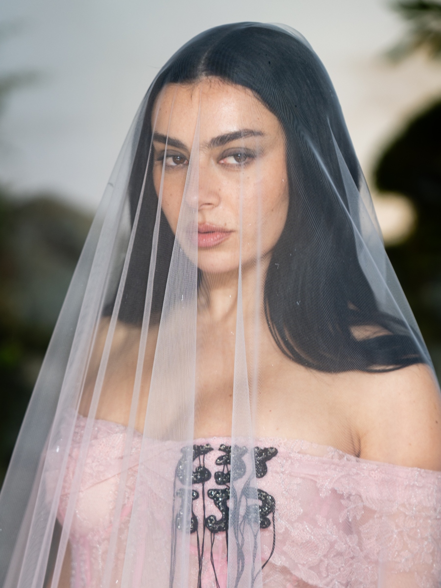 Charli XCX attends the "Wuthering Heights" UK Premiere with gothic- inspired strands and a sheer veil.