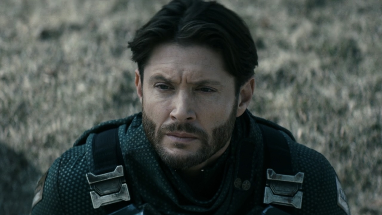 Soldier Boy concerned looking up at Fort Harmony sign in The Boys Season 5