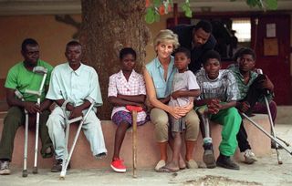 Diana, Princess Of Wales, With Children Injured By Mines At Neves Bendinha Orthopaedic Workshop In Luanda, Angola