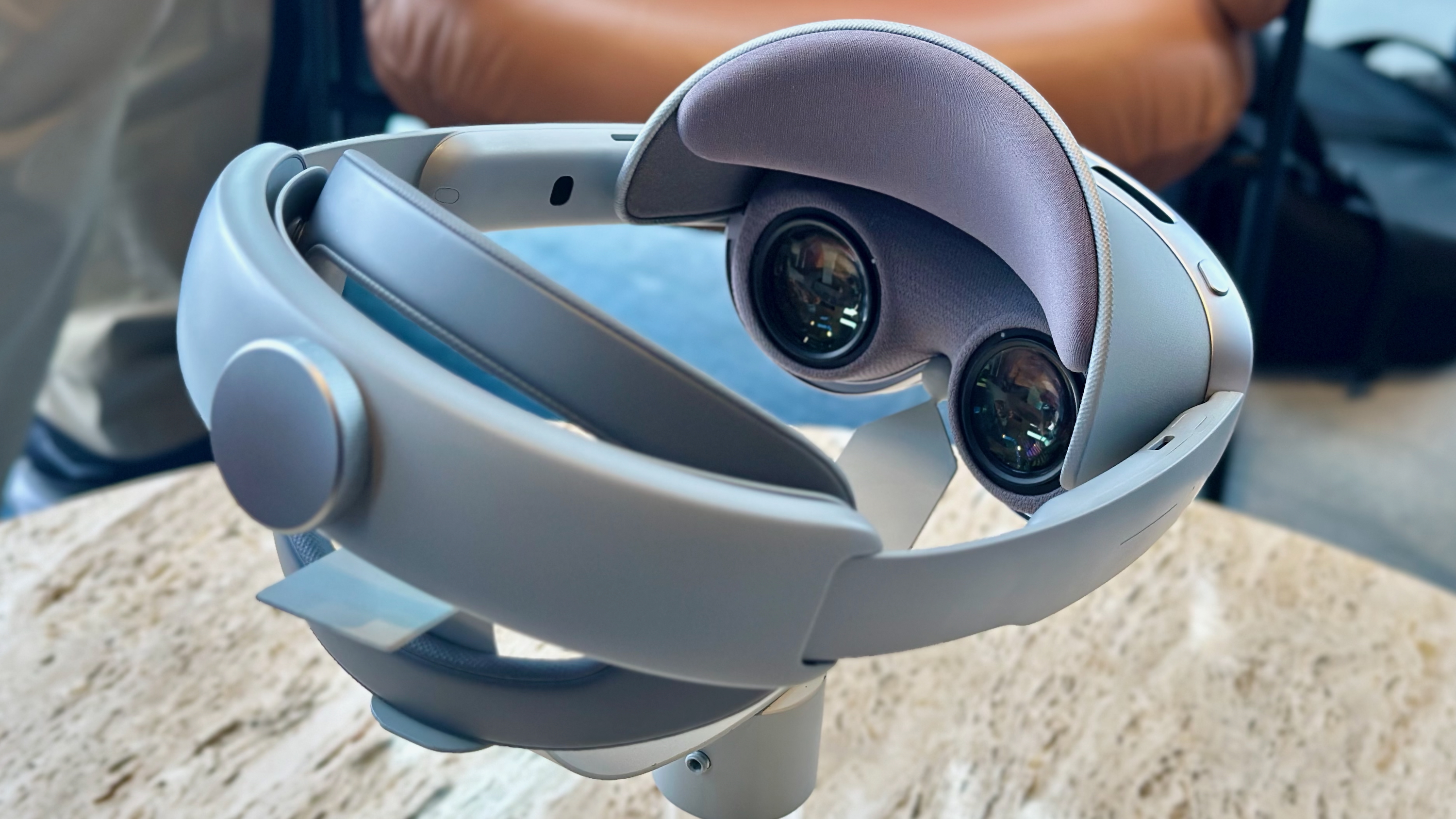 A photo of the Samsung Galaxy XR headset sitting on a pedestal, focused on the lenses and padding.