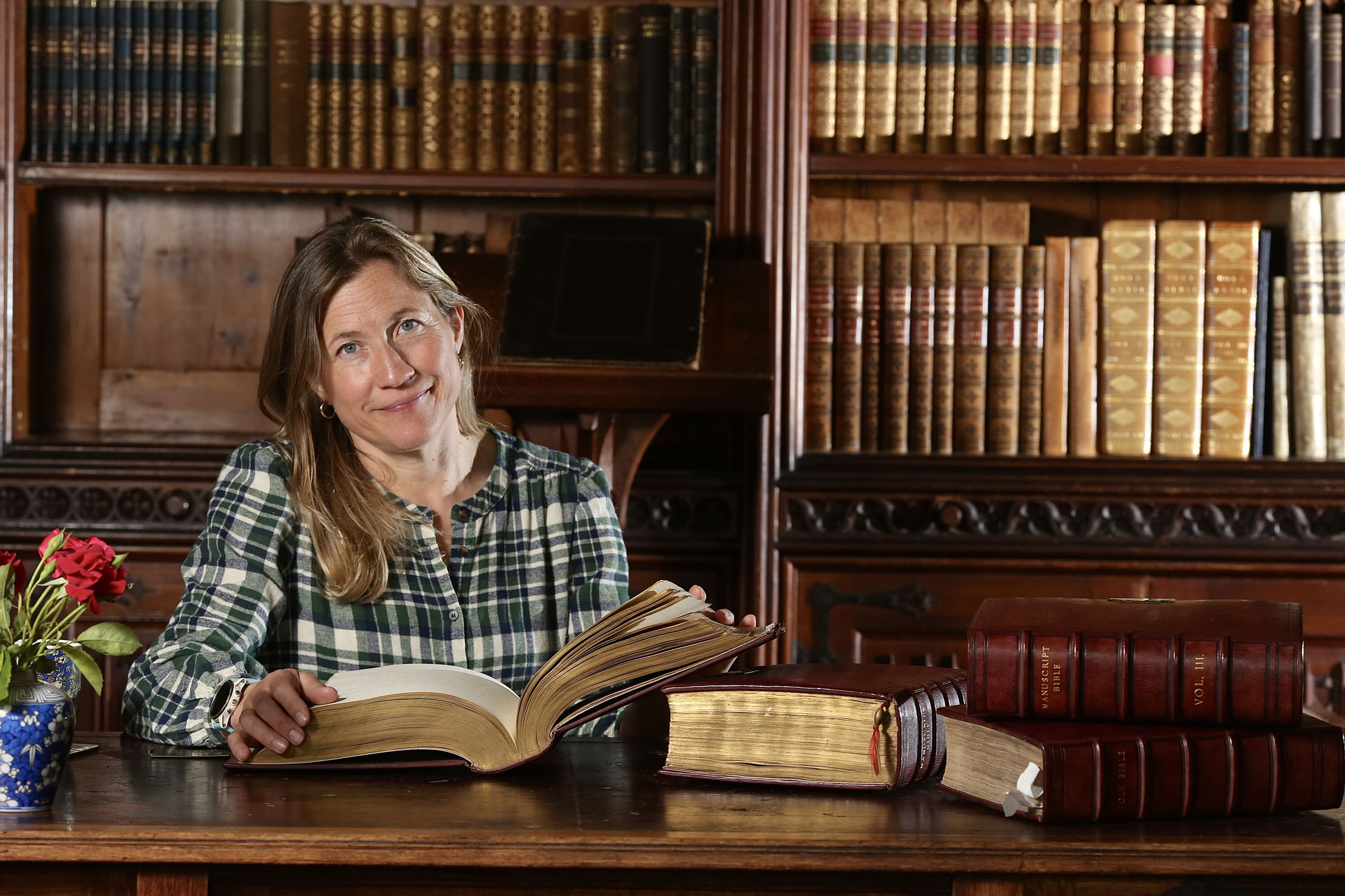 Sally Raikes and the hand-written bible at Treberfydd House in Brecon