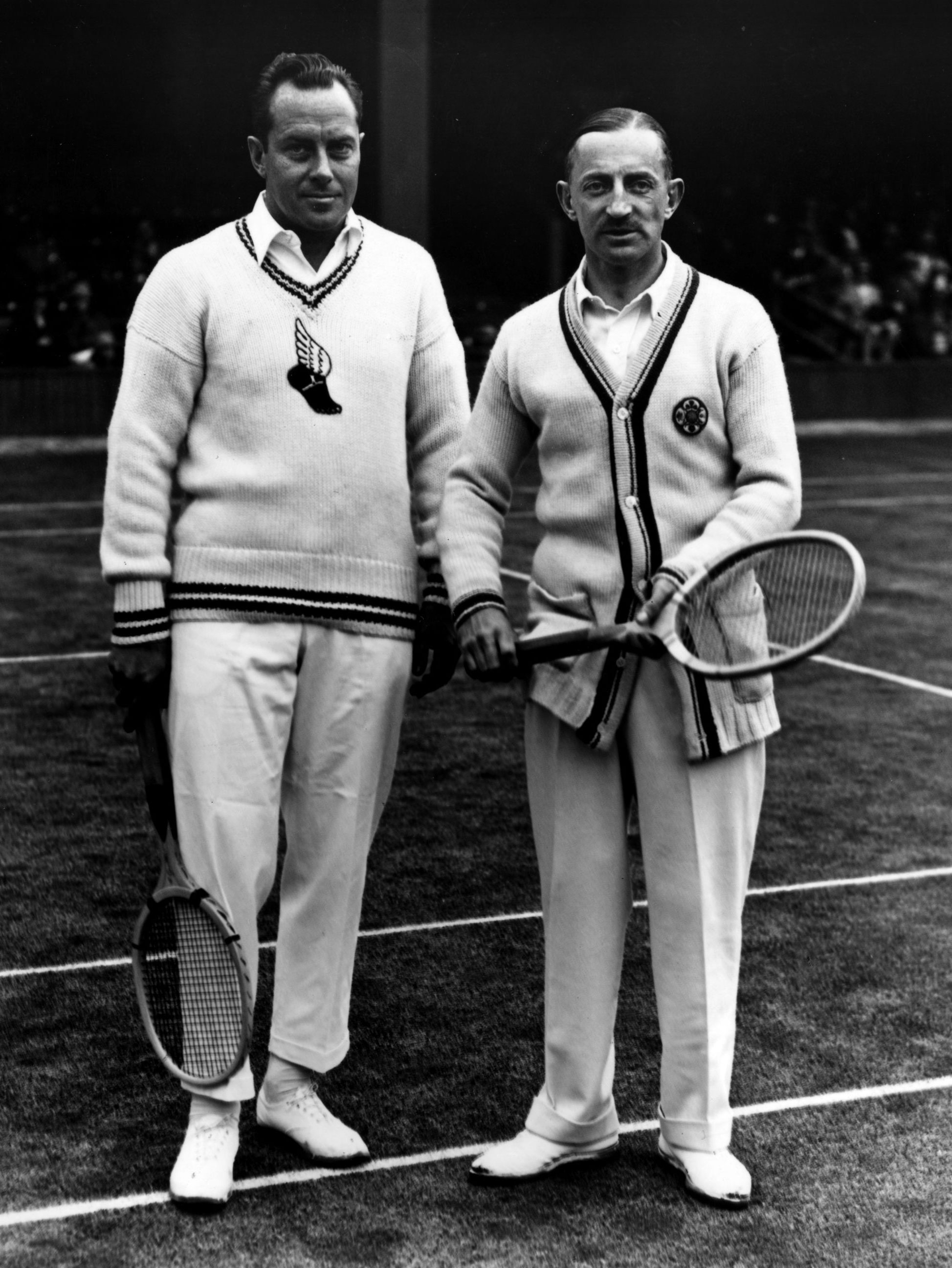 Frank Hunter and Algernon Kingscote wearing varsity sweaters at Wimbledon.