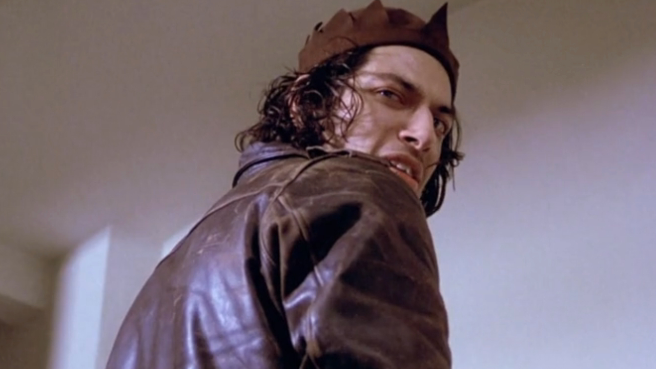 Jeff Goldblum looks over his shoulder with a creepy look in Death Wish.