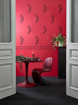 patterned red wallpaper in dining room