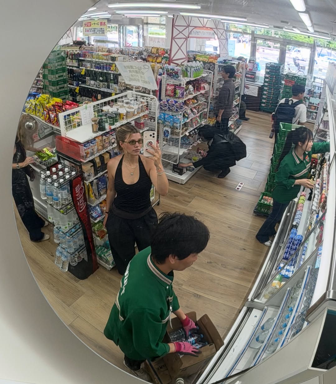 Sofia Richie Grainge shares photos wearing an Adidas track jacket, black baggy pants, and Prada snakeskin ballet sneakers, along with white shorts during a trip to Japan
