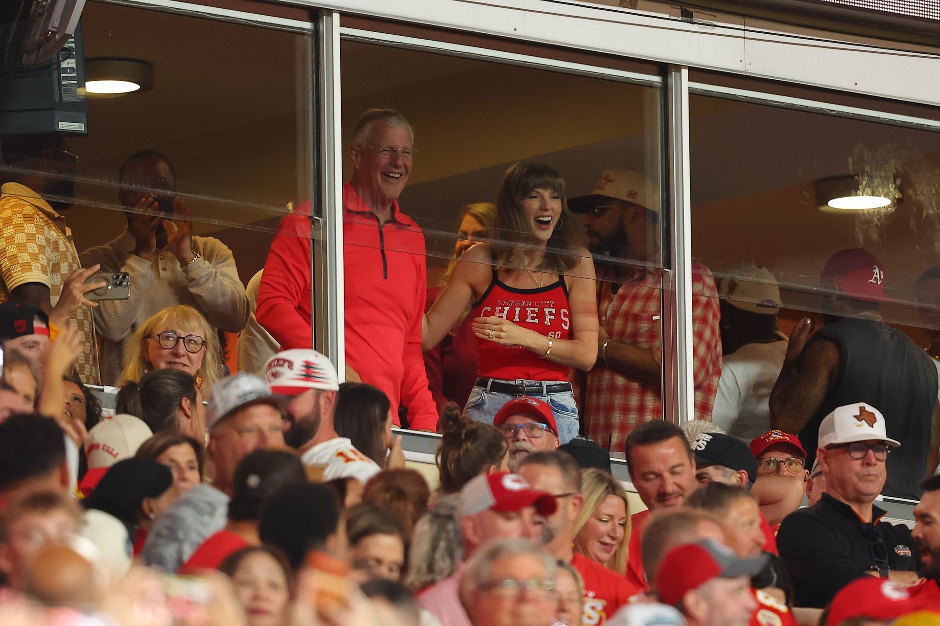 Taylor Swift styled a tank top from WEAR by Erin Andrews at the Kansas City Chiefs vs. Indianapolis Colts game