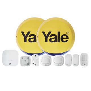 Two yellow burglar alarms with white accessories on a white background