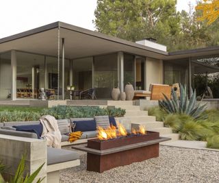 Pebble floor, blue and grey cushions, desert plants