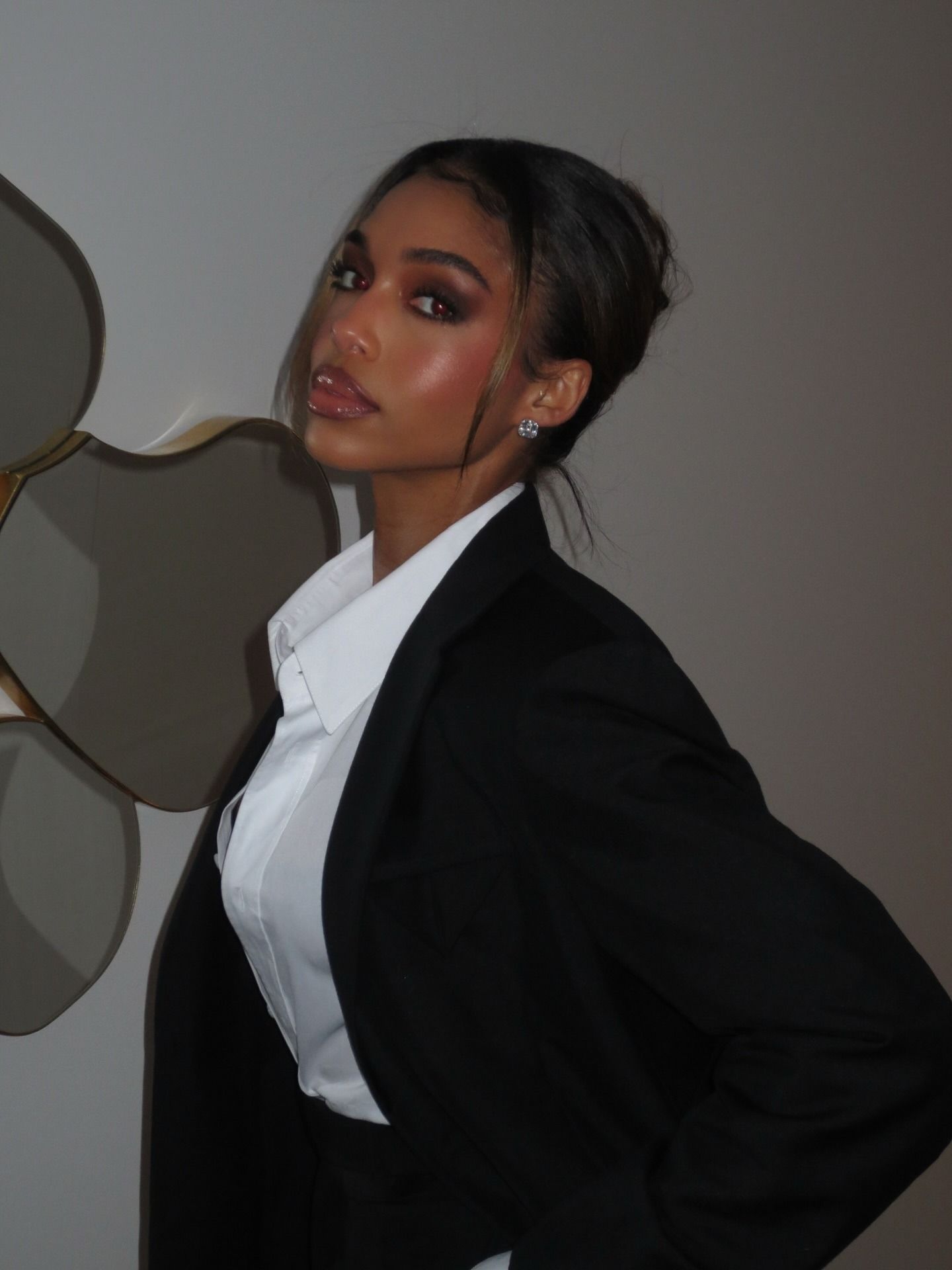 Photo of Lori Harvey wearing full makeup
