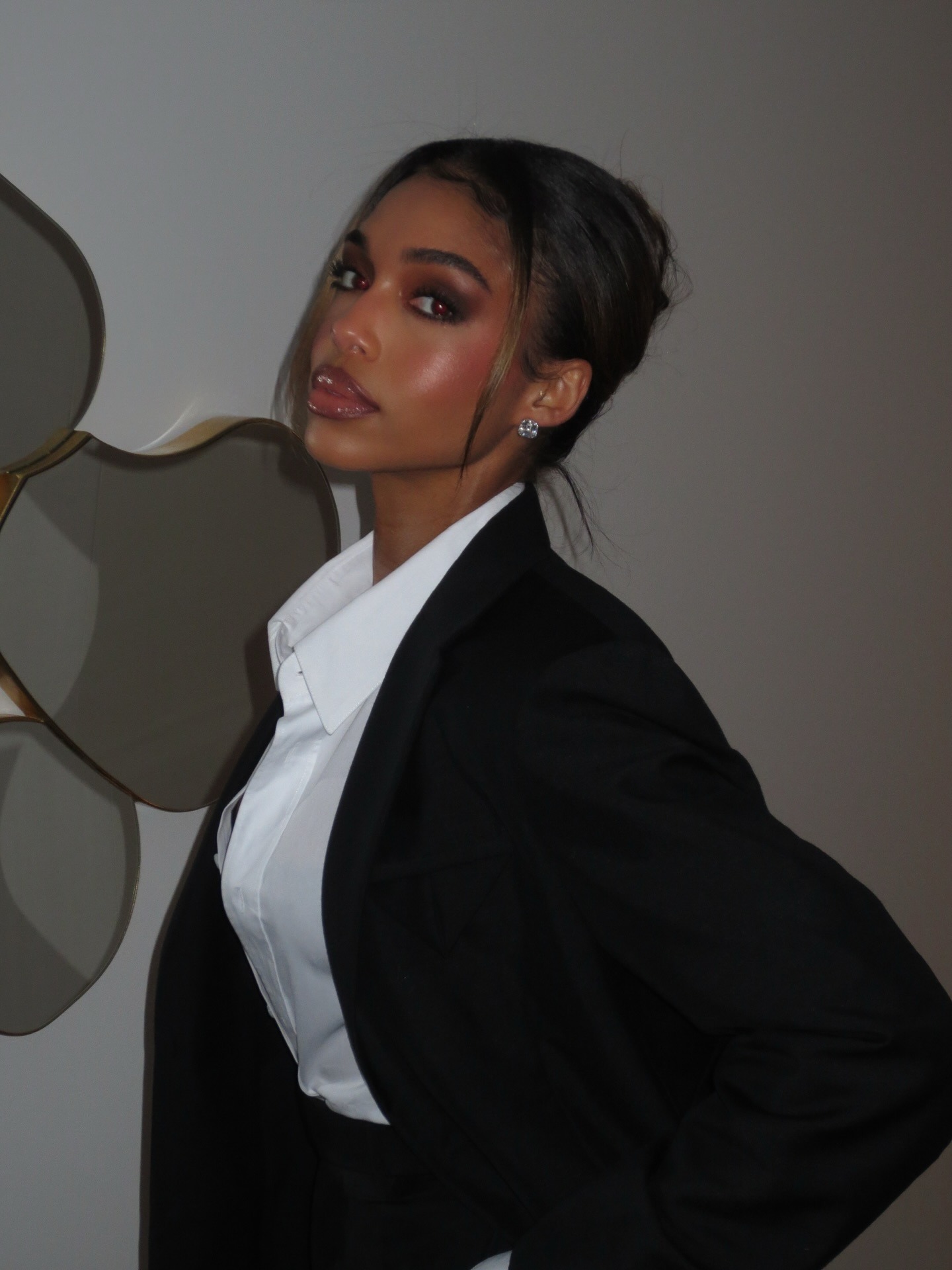 Photo of Lori Harvey wearing full makeup
