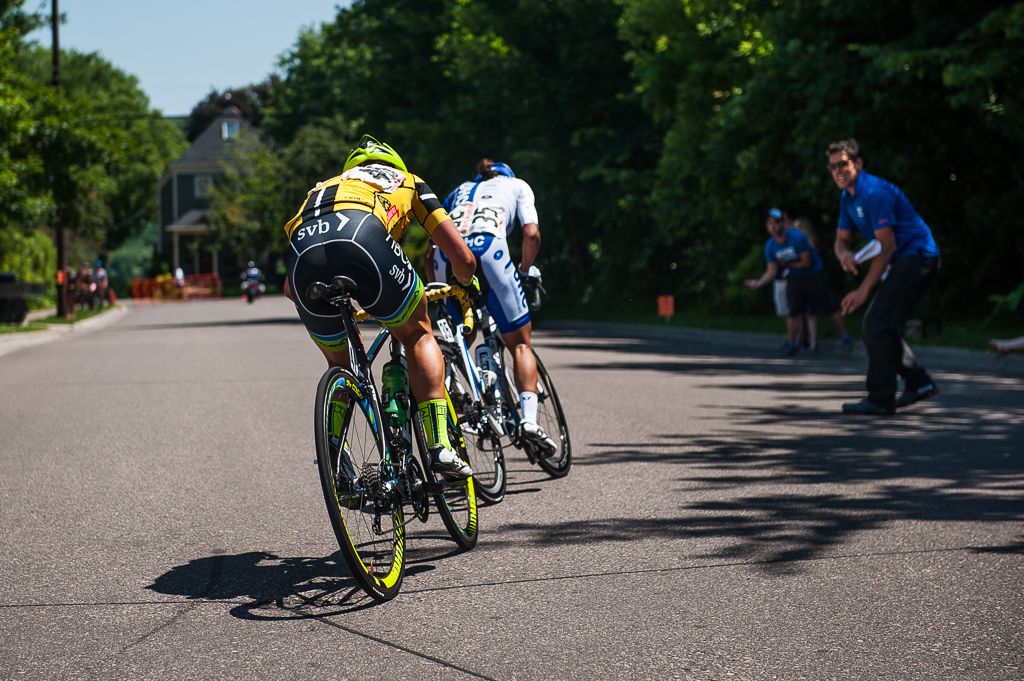 Brianna Walle (Rally Cycling) covers the attack by Coryn Rivera (United Healthcare) as she gets encouragement from team director Mike Tamayo