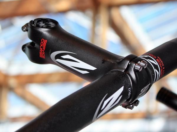 The standard Zipp Service Course forged aluminum stem uses stainless steel hardware while the SL version upgrades to titanium.
