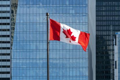 Canadian flag waving on the wind