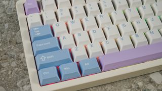 A pink, blue and white Gamakay TK75 Pro wireless mechanical keyboard with hot-swappable linear switches