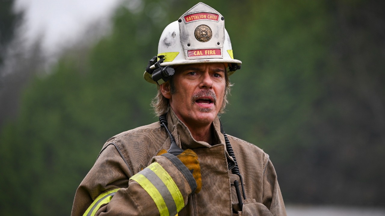 Billy Burke as Vince talking into his walkie on Fire Country.