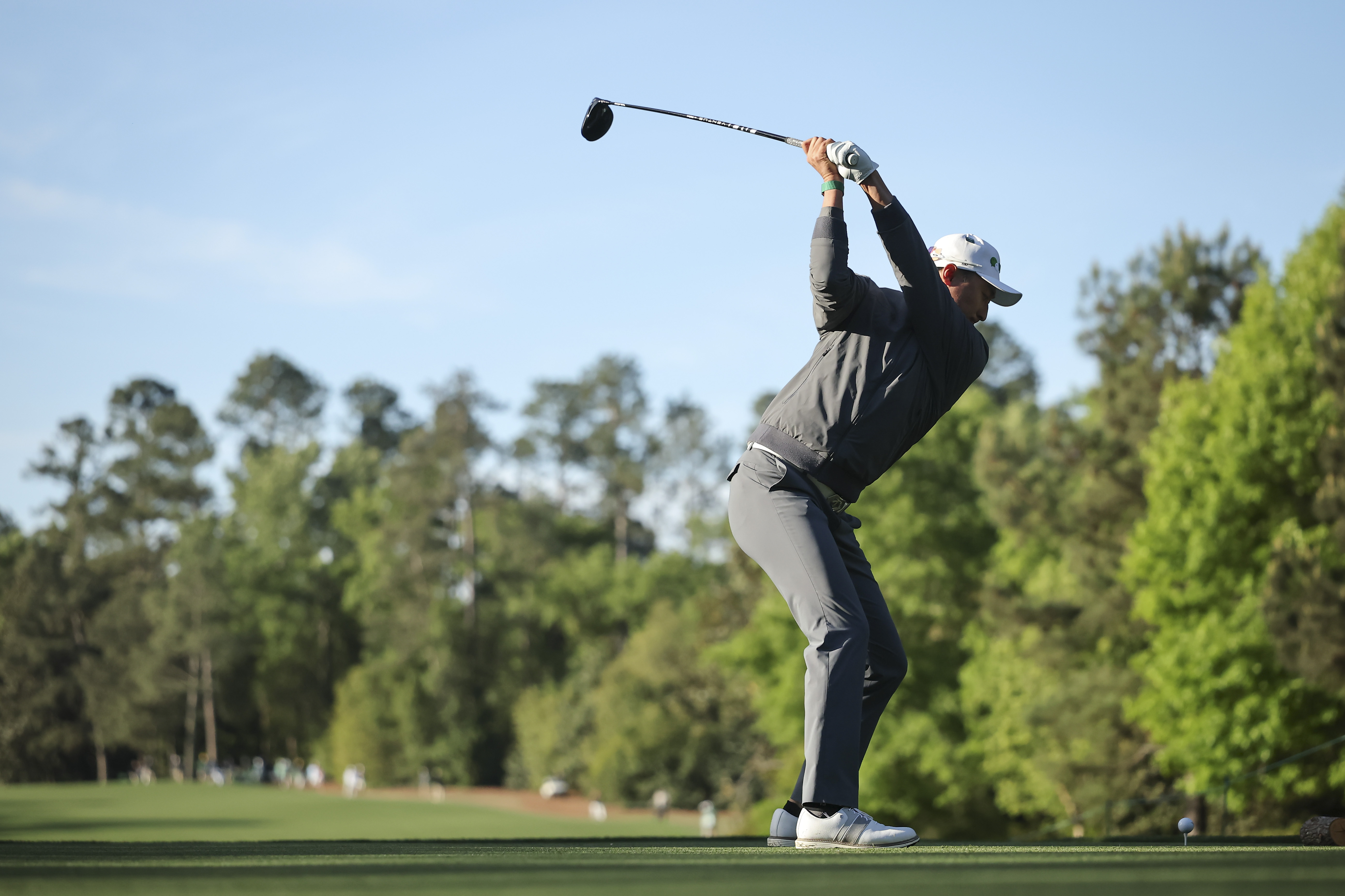 Haotong Li plays his shot from the fifth tee during the first round of the 2026 Masters Tournament at Augusta National Golf Club