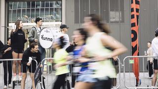 photos of runners at the London Marathon in front of a Runna banner