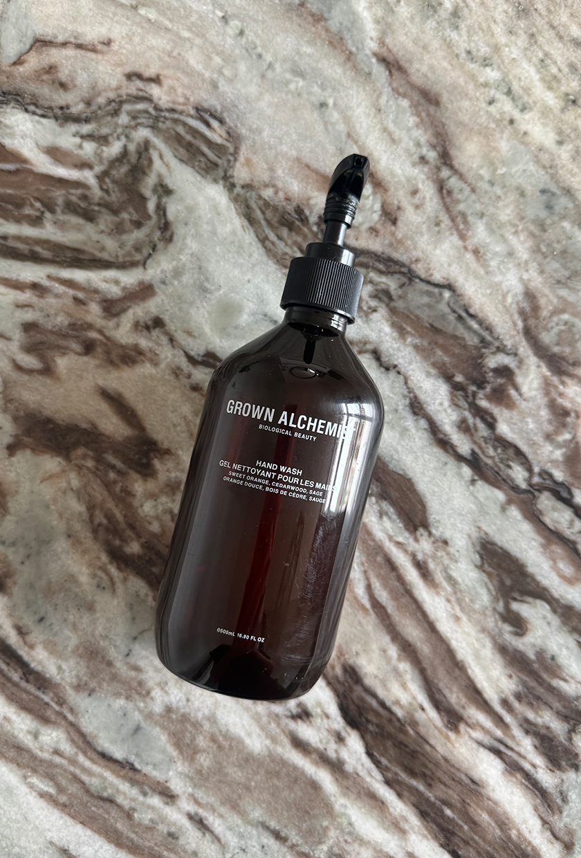 grown alchemist hand soap on marble table