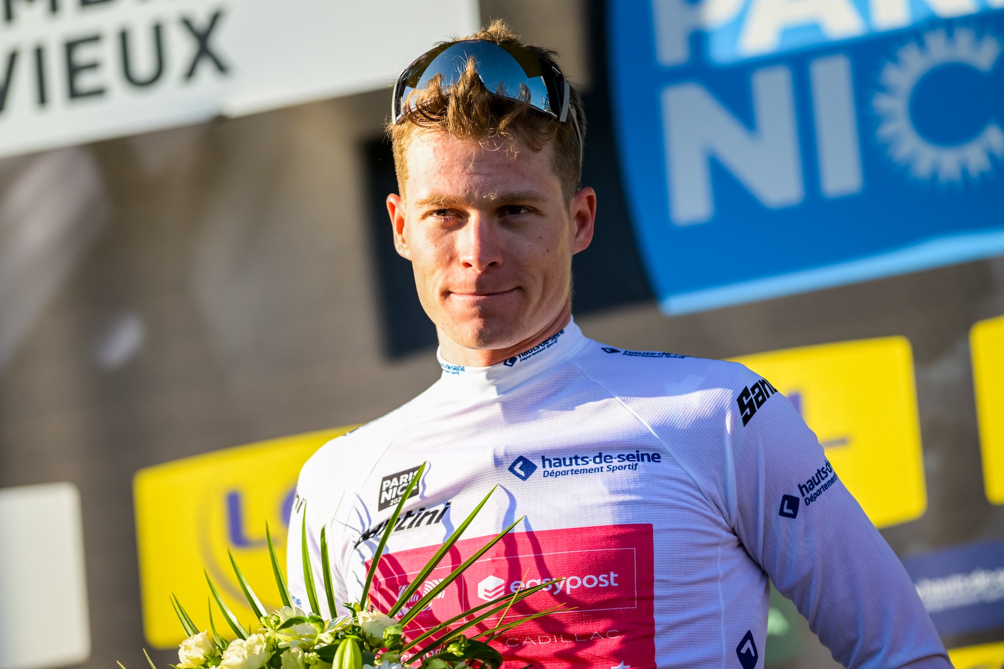 German Georg Steinhauser of EF Education-EasyPost celebrates in the white jersey for best young rider after the fifth stage of 84th edition of the Paris-Nice cycling race, a race from Cormoranche-sur-Saone to Colombier-le-Vieux (205,4km), on Thursday 12 March 2026. BELGA PHOTO DAVID PINTENS (Photo by DAVID PINTENS / BELGA MAG / Belga via AFP)